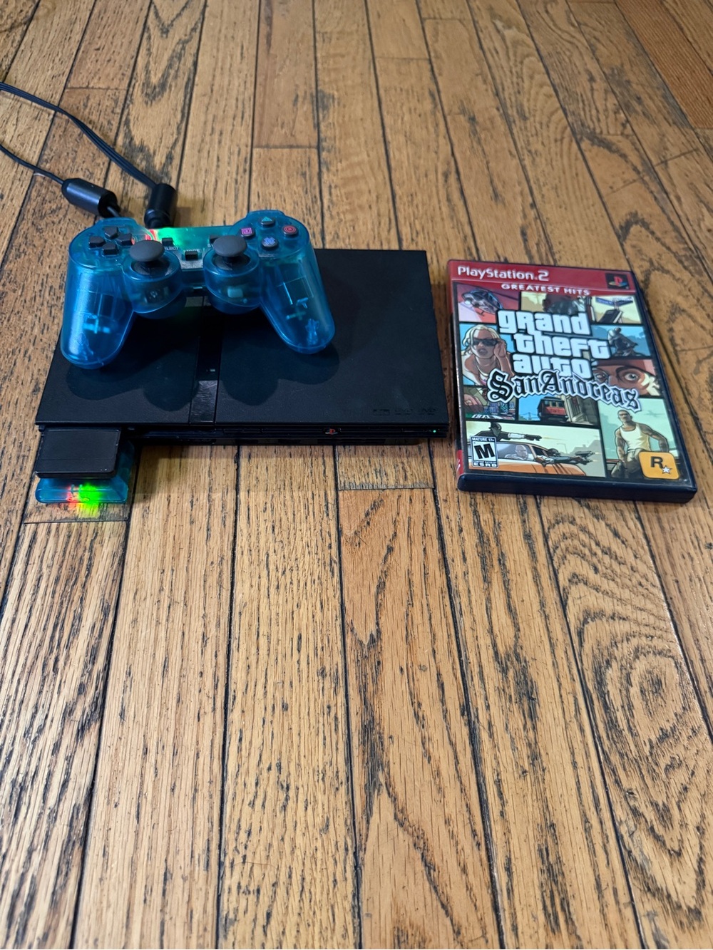 Sony PlayStation 2 Slim with Teal Transparent Controller and GTA: San Andreas